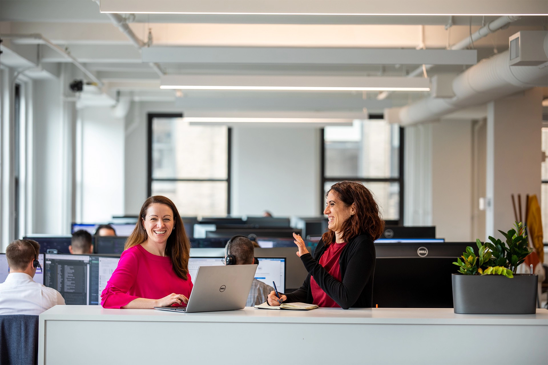 Two women laughing at Adaptive